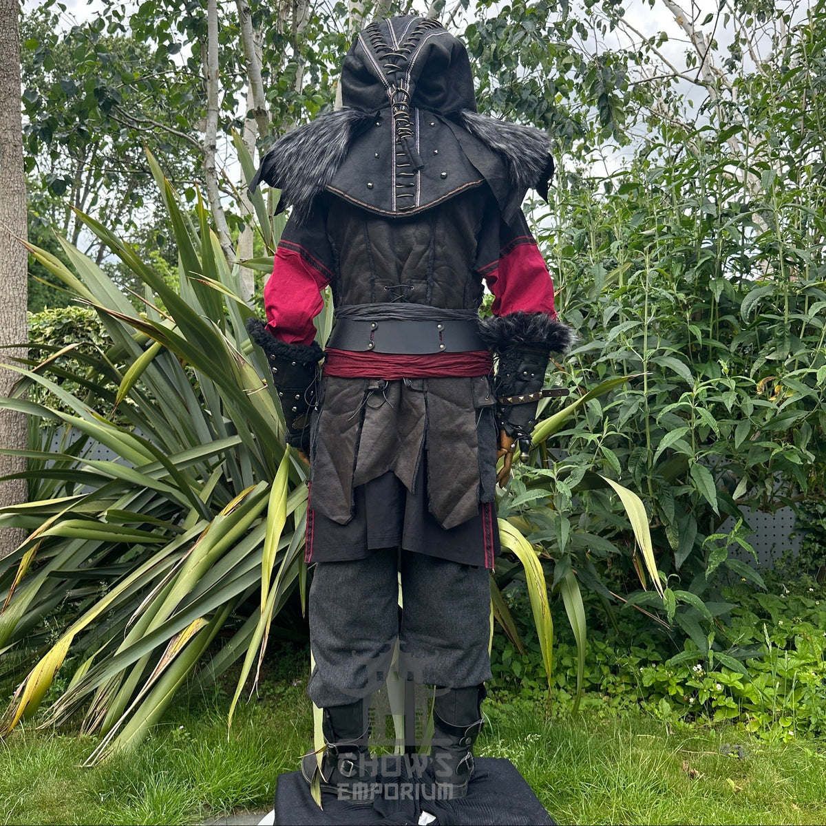 Medieval LARP outfit back view, featuring an ornate hood, waistcoat, tunic, trousers, vambraces.