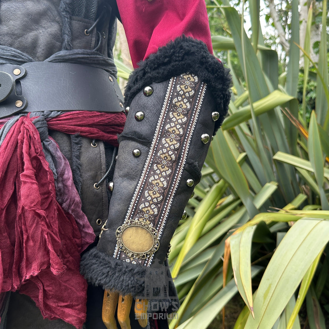 Crimson Assassin LARP outfit with ornate vambrace and detailed red sash.