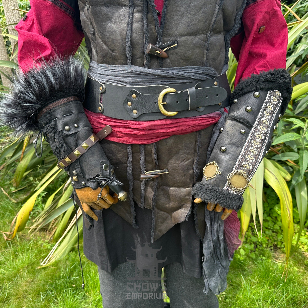 Crimson Assassin LARP outfit close-up: black vambraces, belt, red tunic.