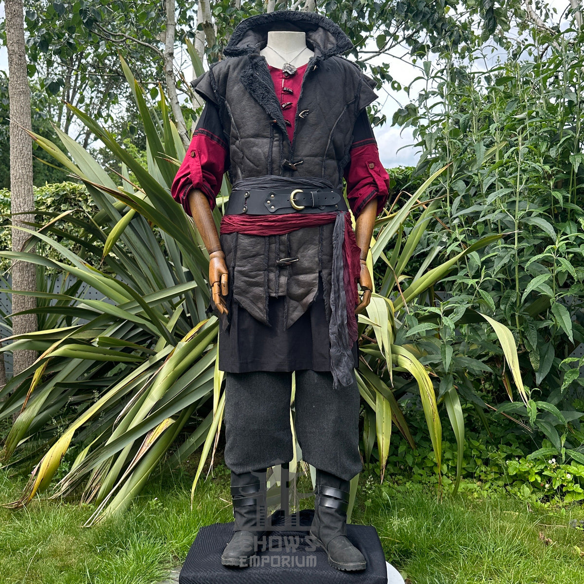 Medieval LARP costume with red tunic and black waistcoat.