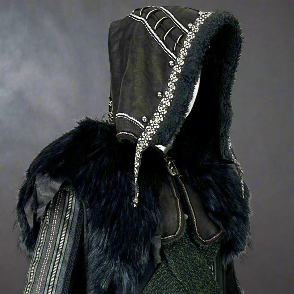 Dark hooded LARP costume with fur and metal accents, side view.