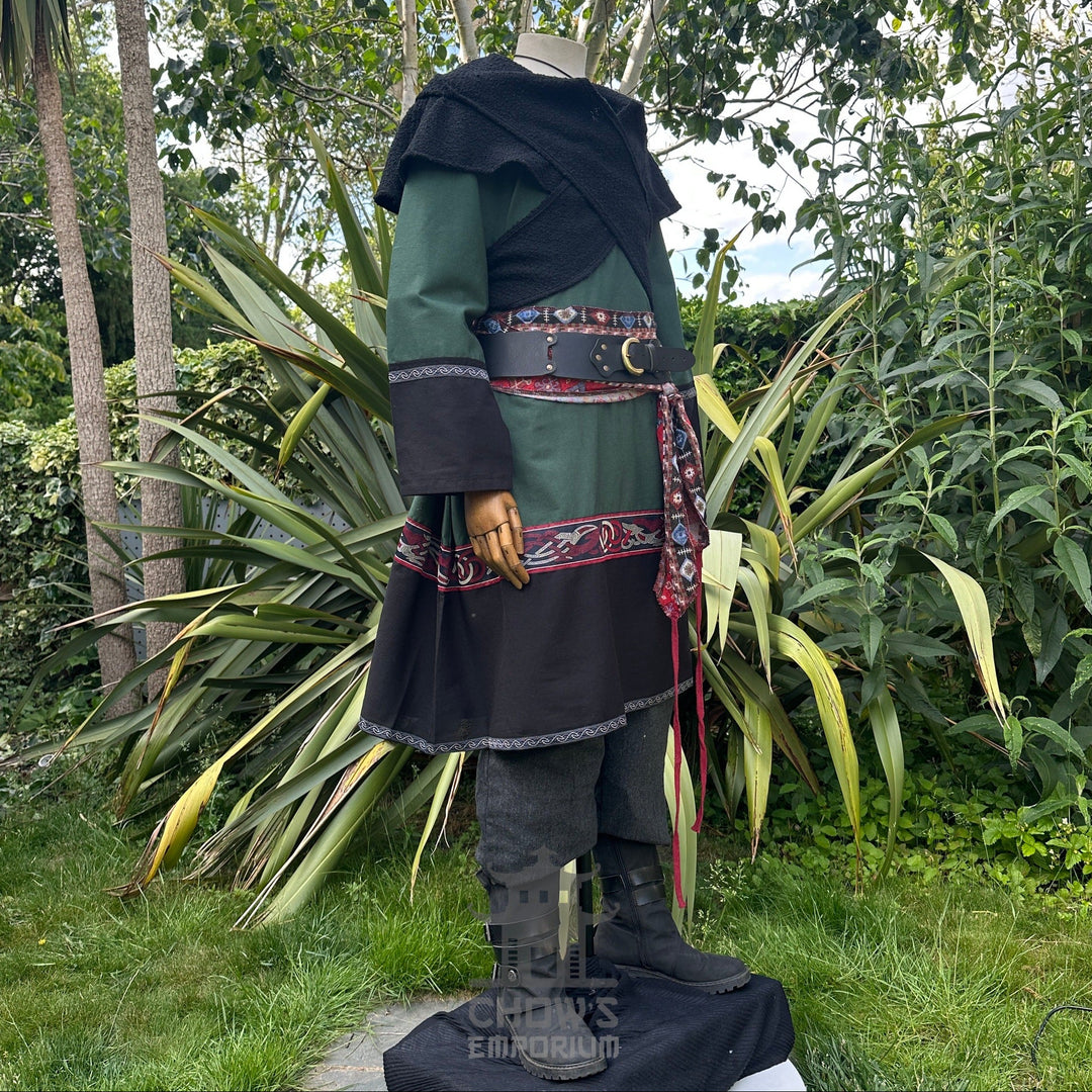 Mannequin in medieval LARP attire, green tunic with black trim and red sash.