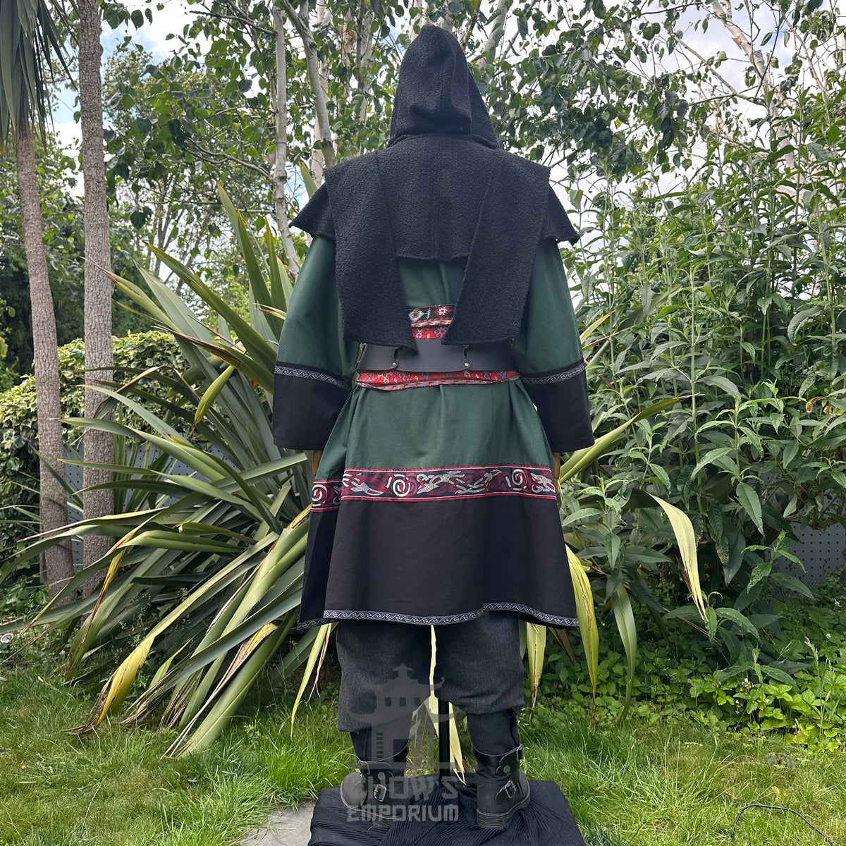 LARP medieval outfit: green tunic, black hood, trousers, sash, rear view.