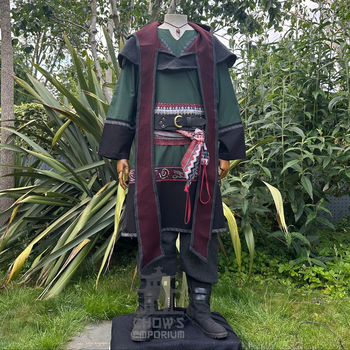 Green and black medieval LARP outfit with tunic, hood, trousers, sash.