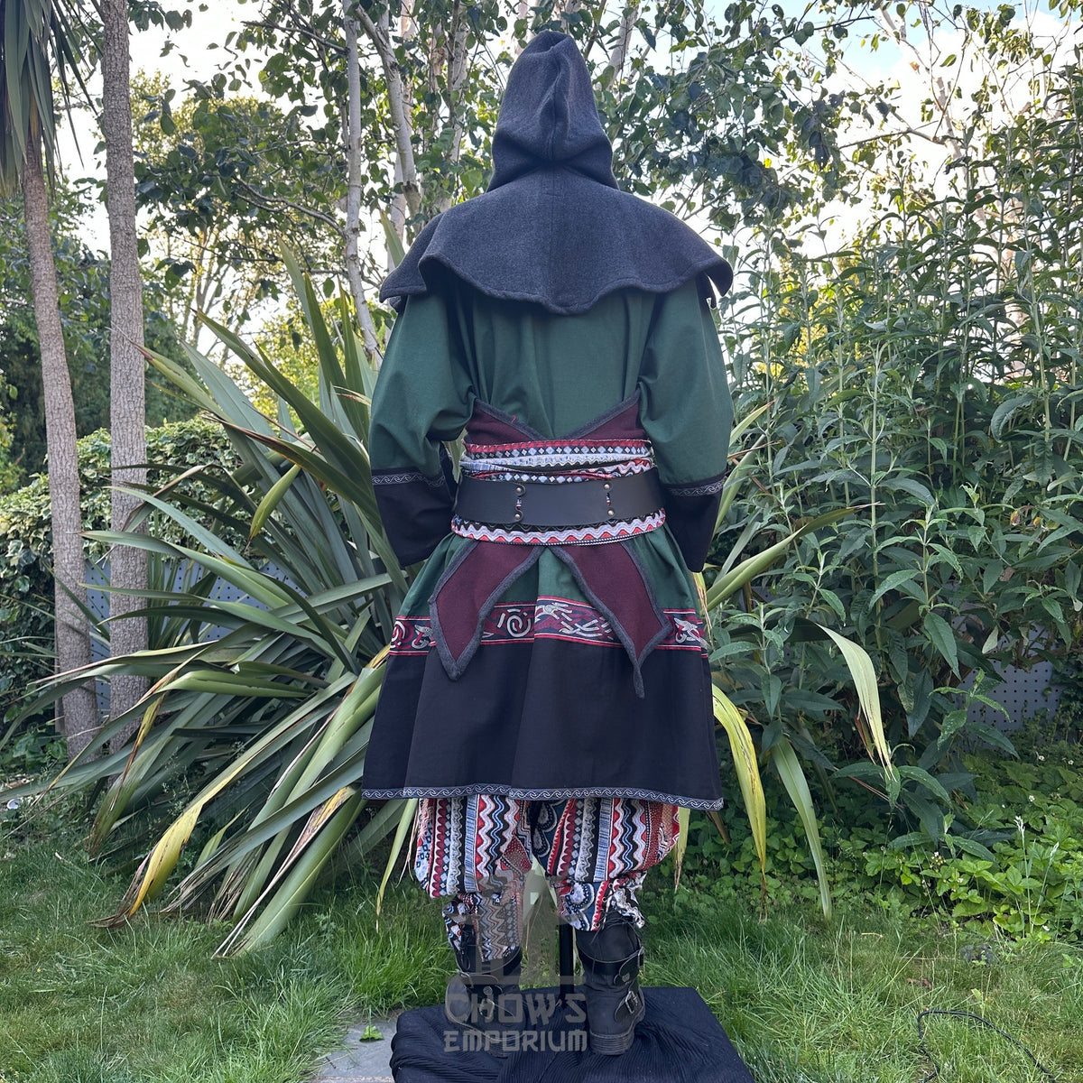 Medieval LARP outfit back view, featuring a green and black Viking tunic, reversible hood.