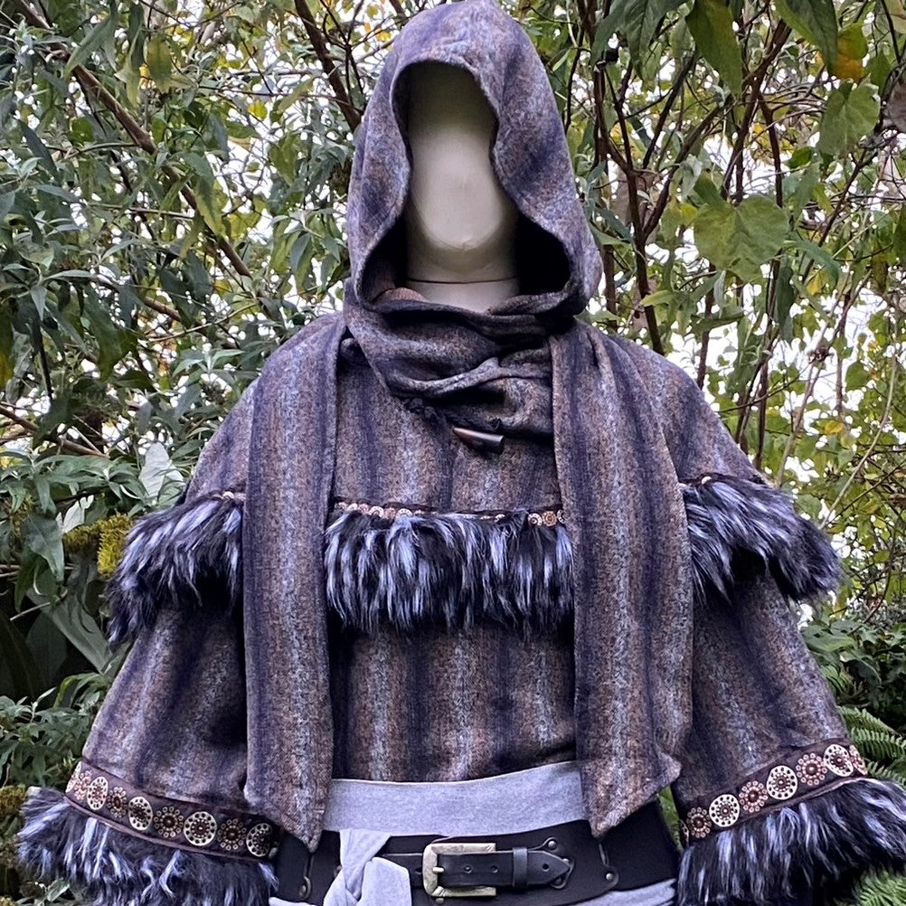 Arcane Warrior LARP outfit with blue tunic, fur trim, hood, and sash.