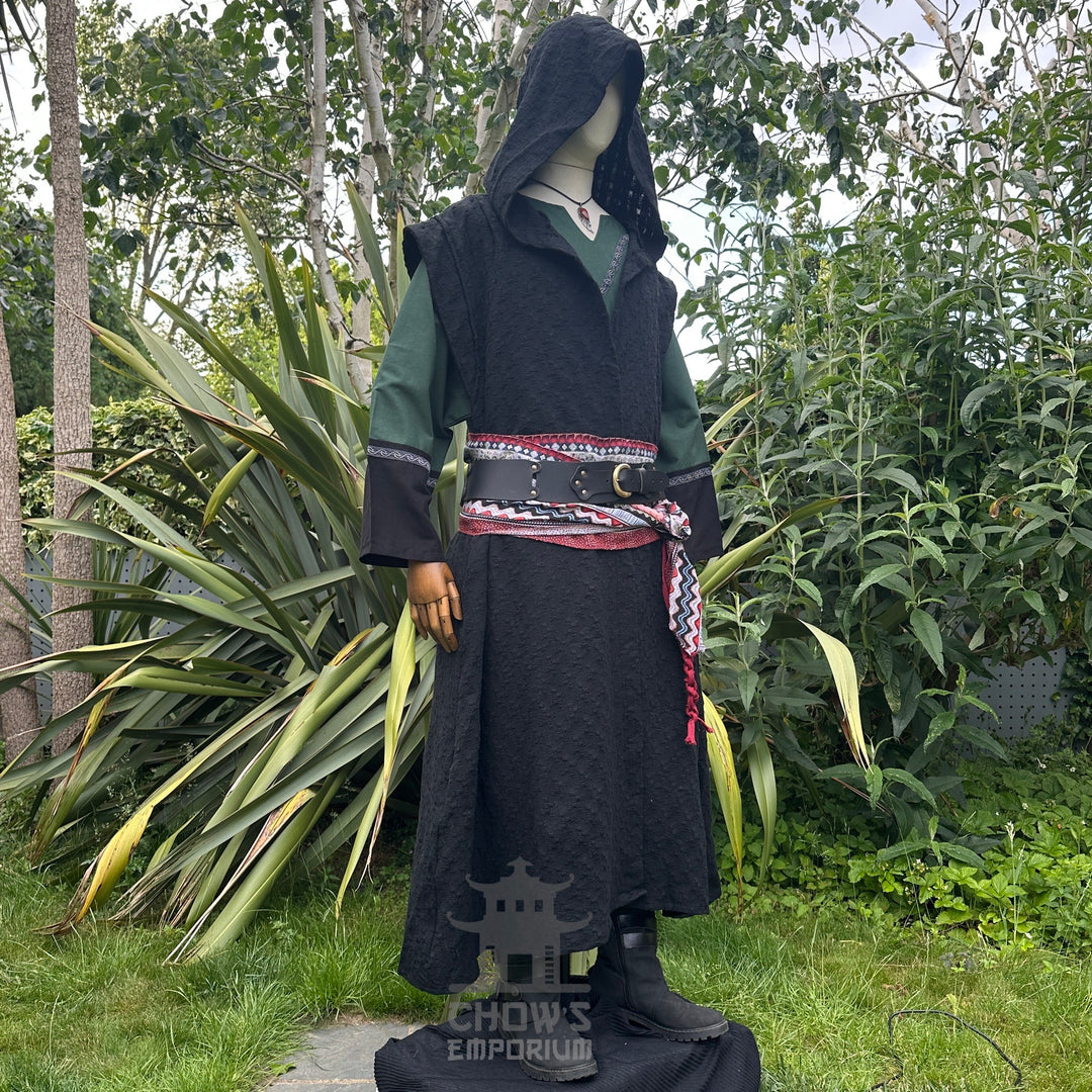 Medieval LARP costume side view featuring sleeveless robe, tunic, hood, pants, belt and sash.