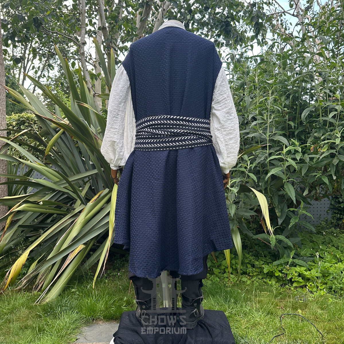 Medieval LARP costume back view, includes blue and white waistcoat with asymmetrical front.