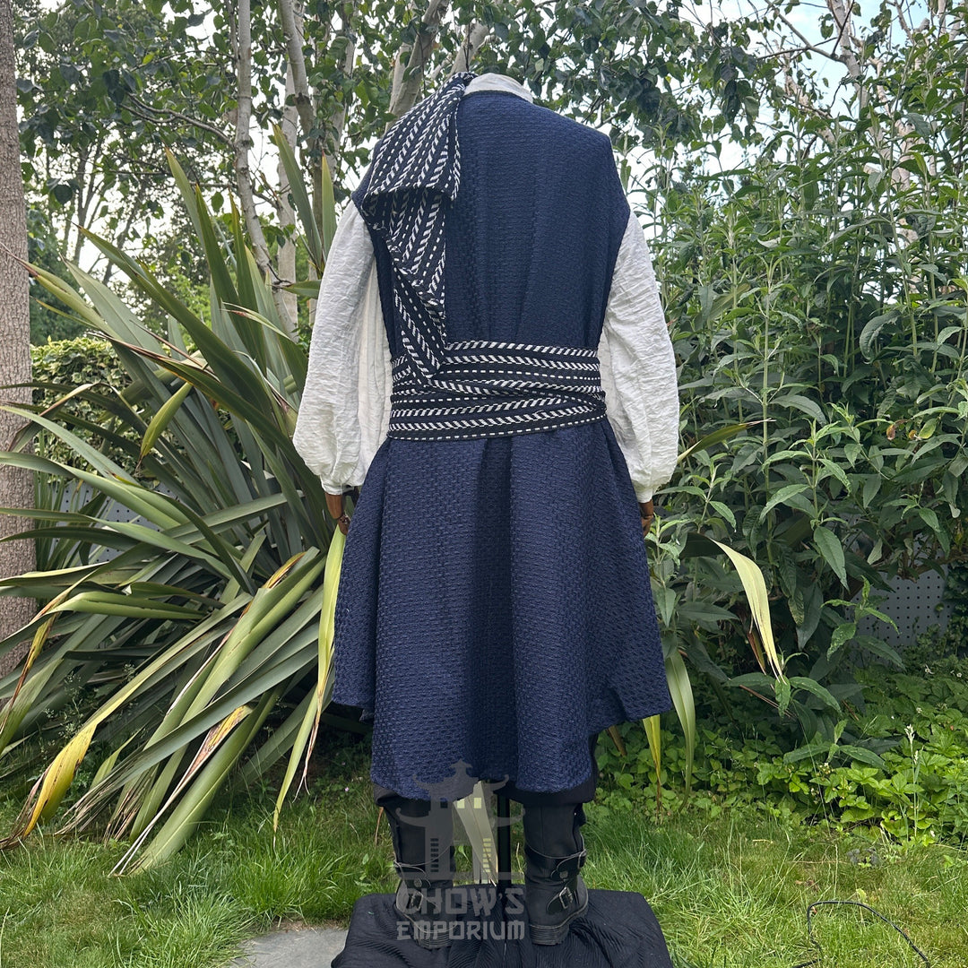 Back view of blue and white pirate costume with panel worn over shoulder for dramatic fantasy look.