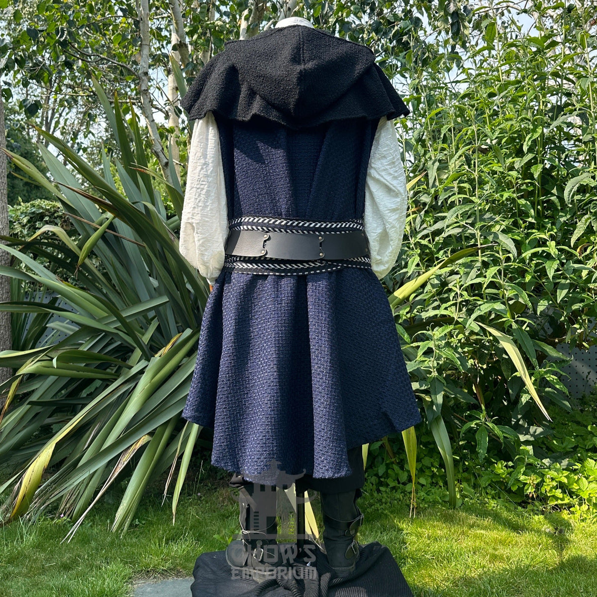 Rear of LARP set with black hooded cape and detailed leather belt.