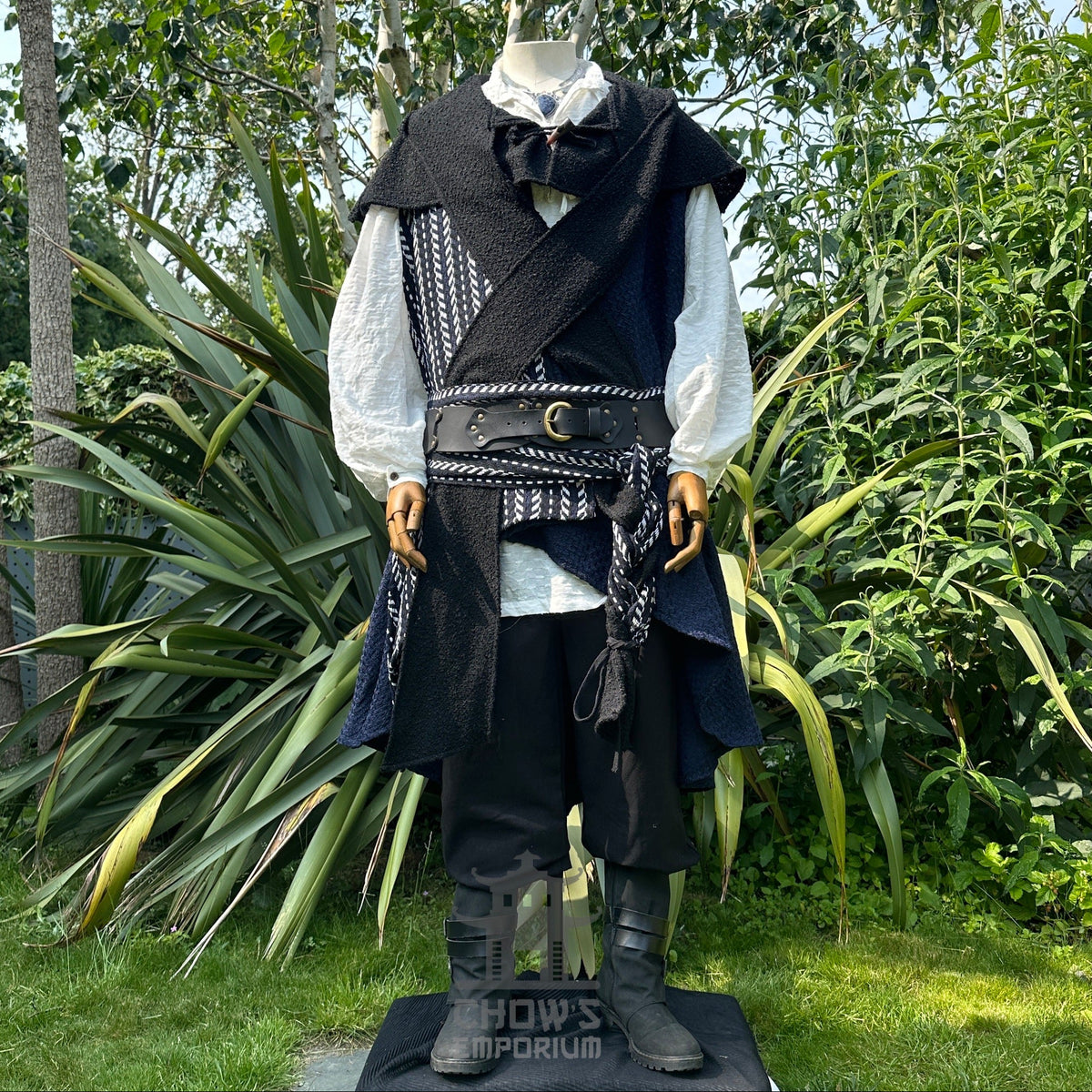 Medieval LARP outfit front view, featuring blue asymmetrical waistcoat, hood, shirt, trousers.