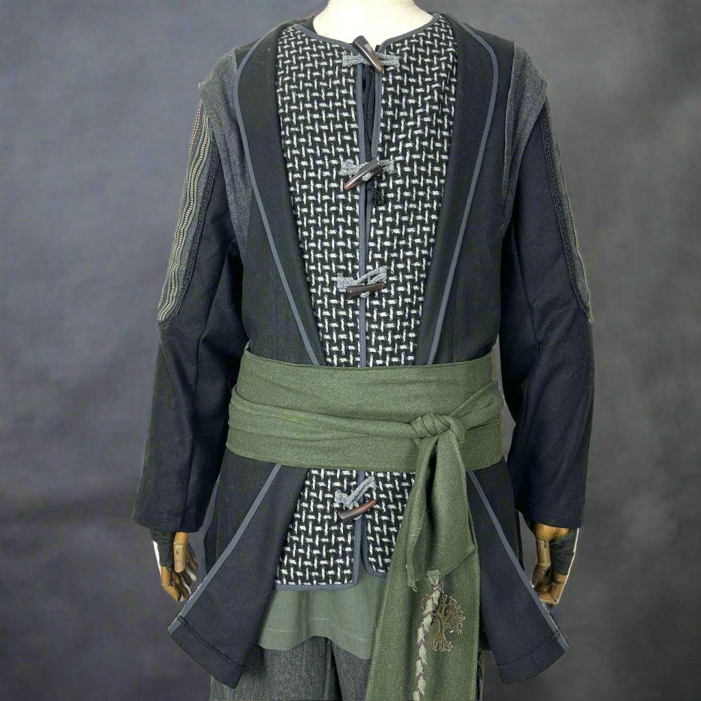 Medieval LARP costume in black and grey with green sash, front view.