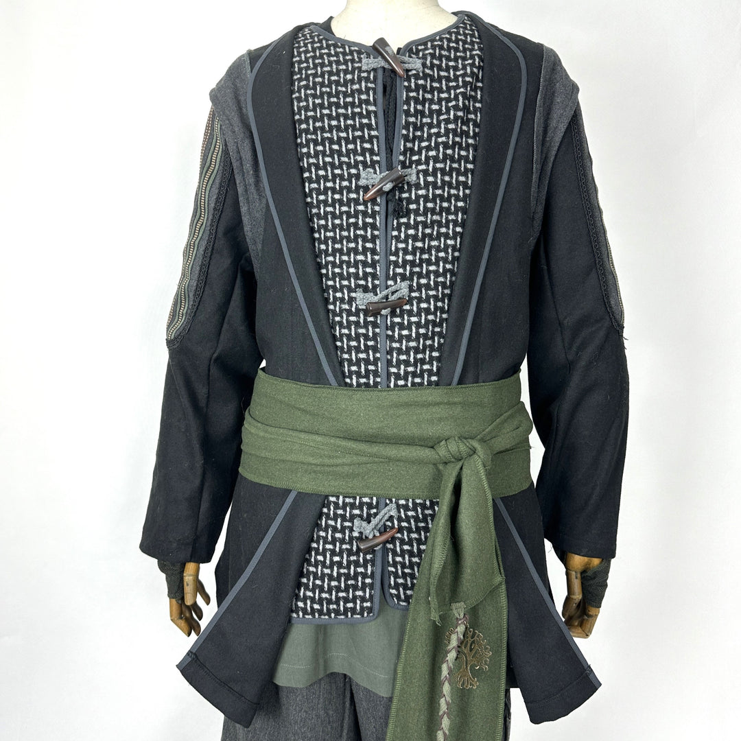 Close-up of ornate panel embroidery and decorative braiding on wool fantasy jacket.