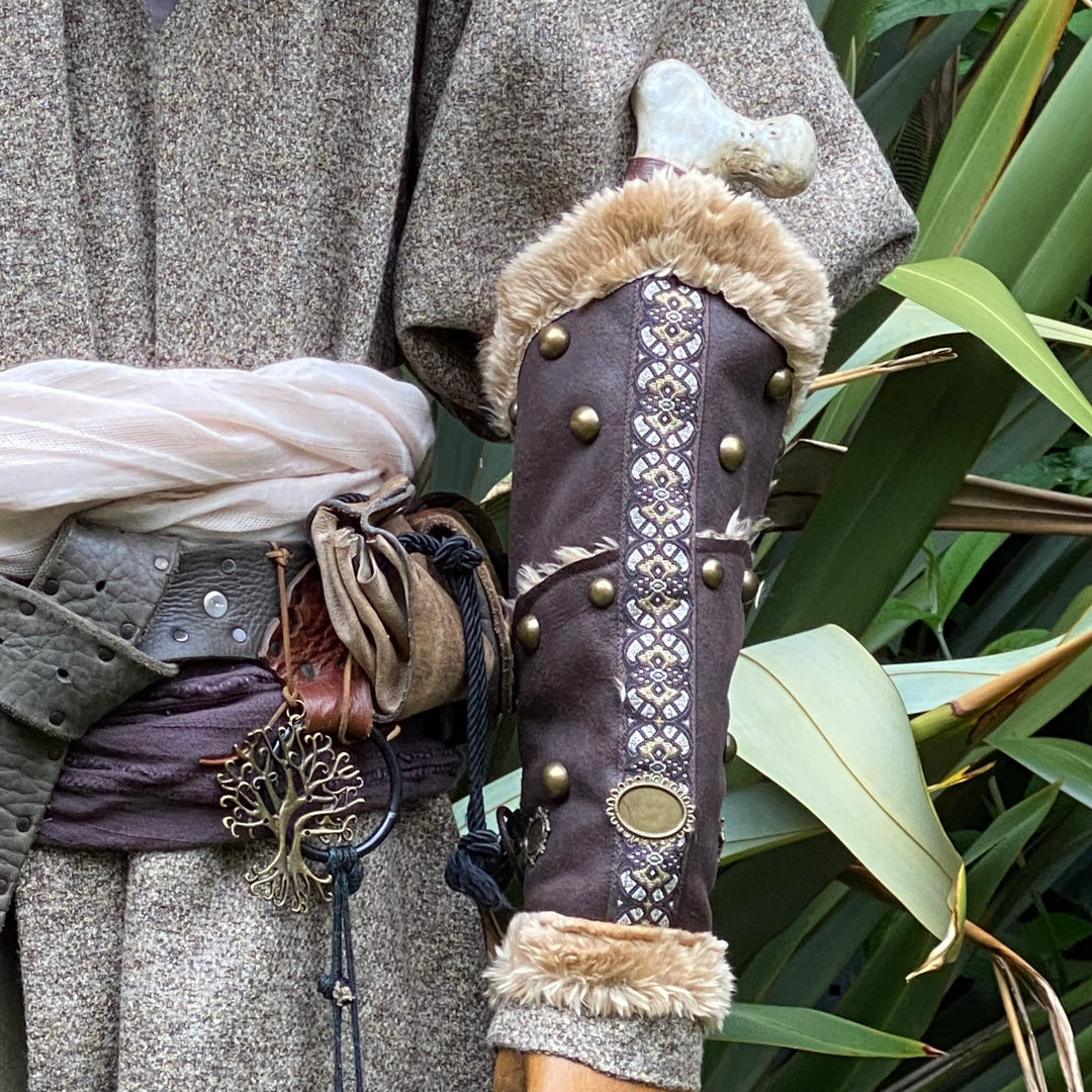 Medieval LARP brown vambrace with fur trim and decorative studs.