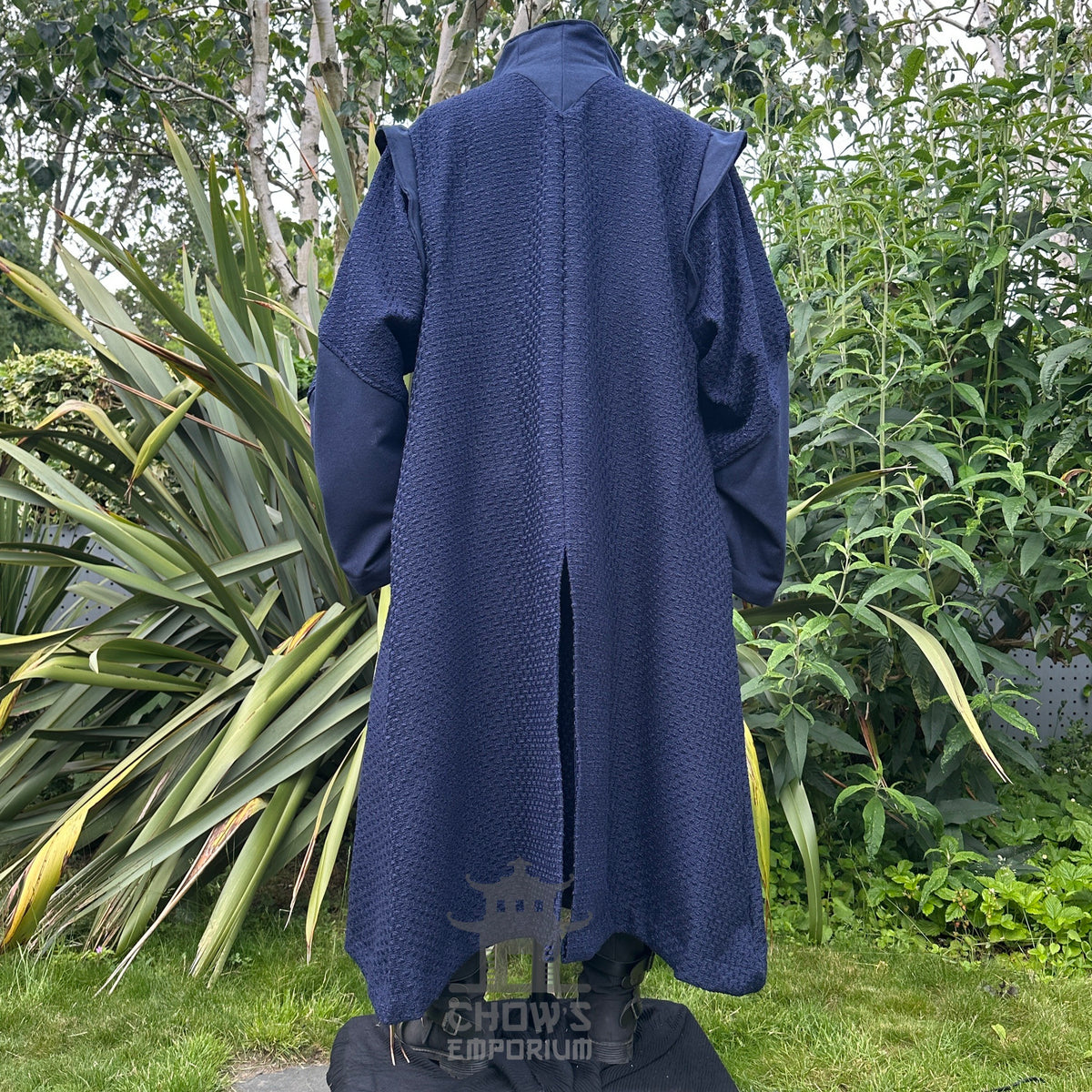 Medieval LARP costume back view featuring a robe, waistcoat, shirt, pants, sash and necklace.