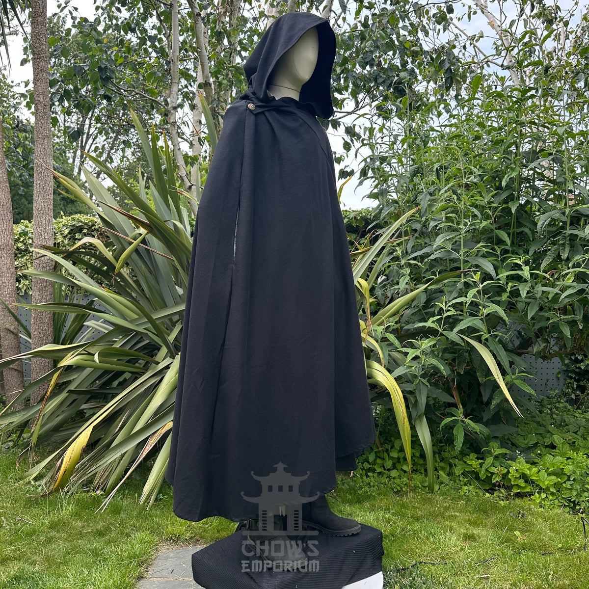 Angled view of hooded black wool medieval cloak, fantasy cosplay costume for LARP and.