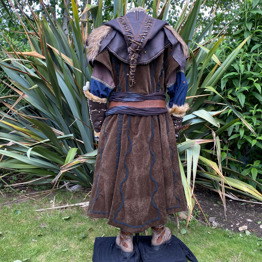 Back view of brown medieval LARP outfit with fur-trimmed hood and vambraces.