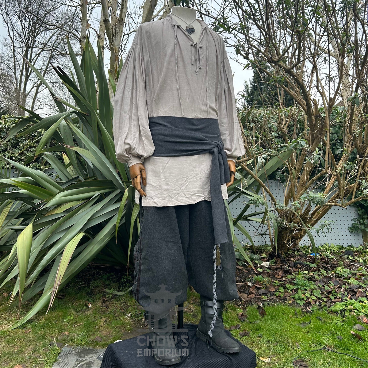 LARP Shadow Merchant set with grey sash, cream shirt, and dark trousers.