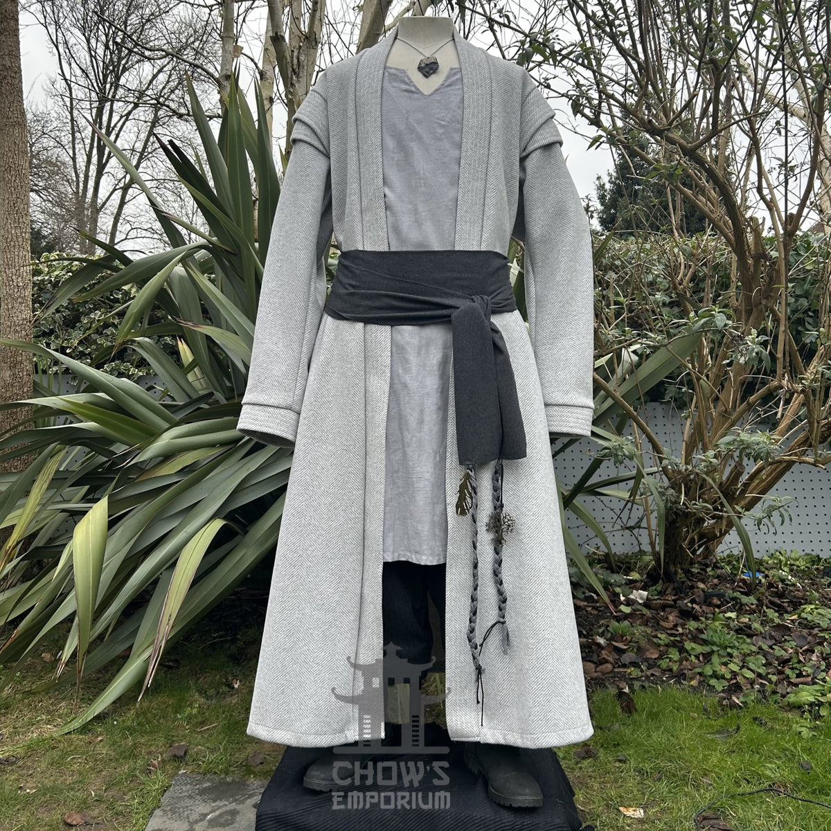 Medieval LARP costume front view, featuring a light grey full length robe, tunic, trousers, and.