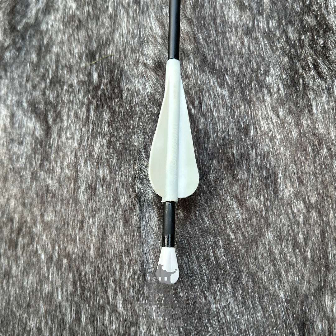 Bow arrow with white nock on a textured grey background.
