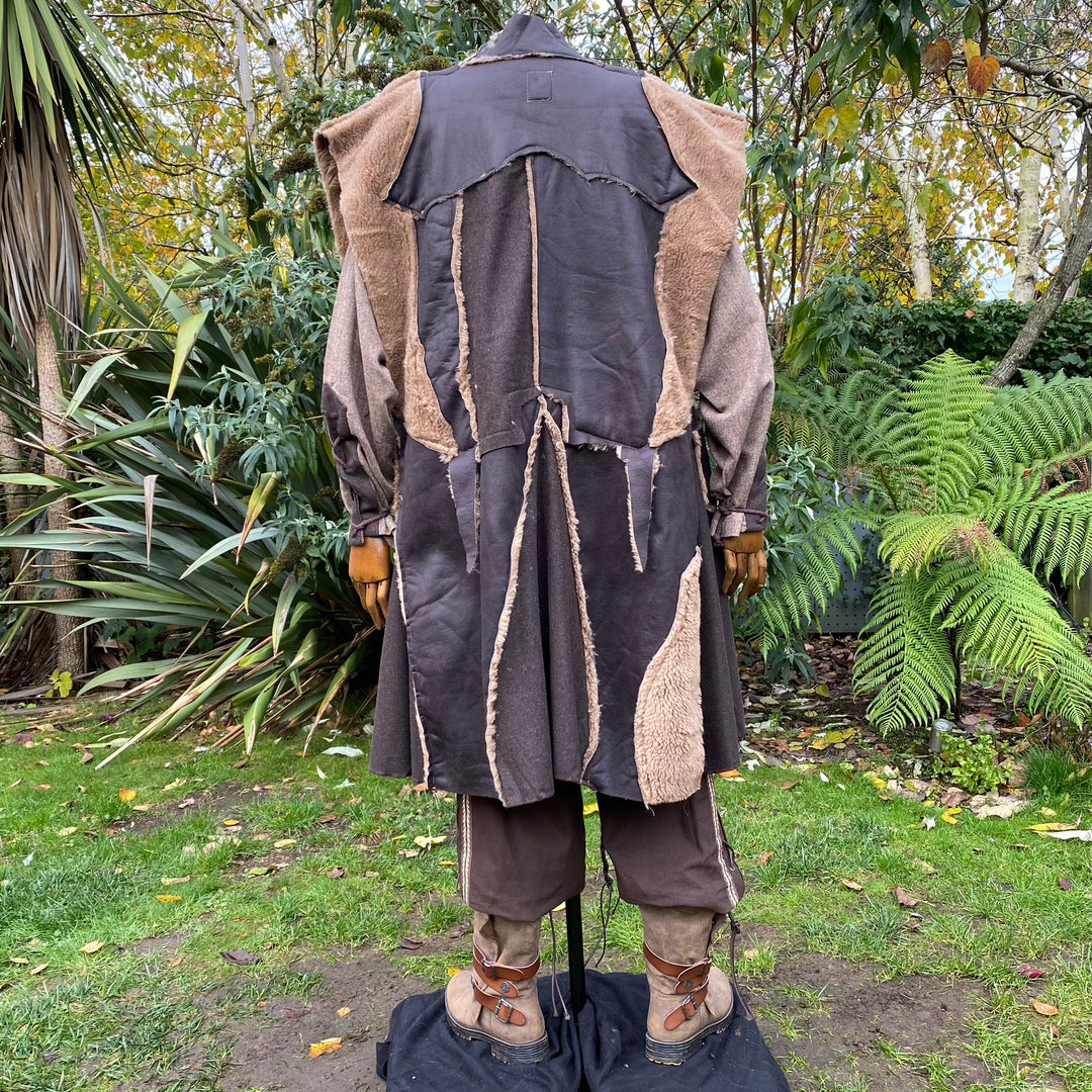 Rear view of Viking patchwork waistcoat in brown faux leather for LARP.