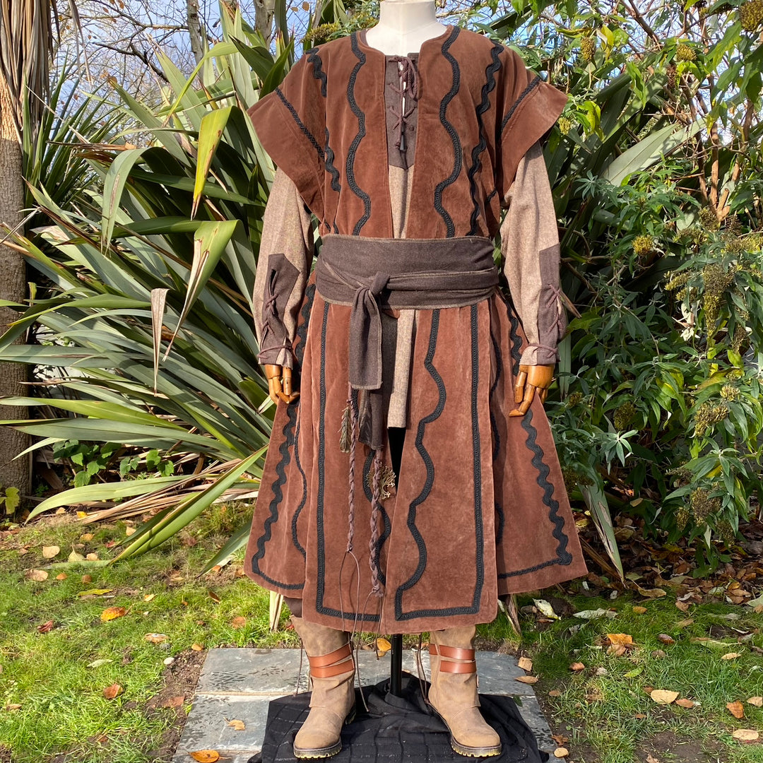 Medieval LARP costume with ornate braiding, brown suede, wide angle.