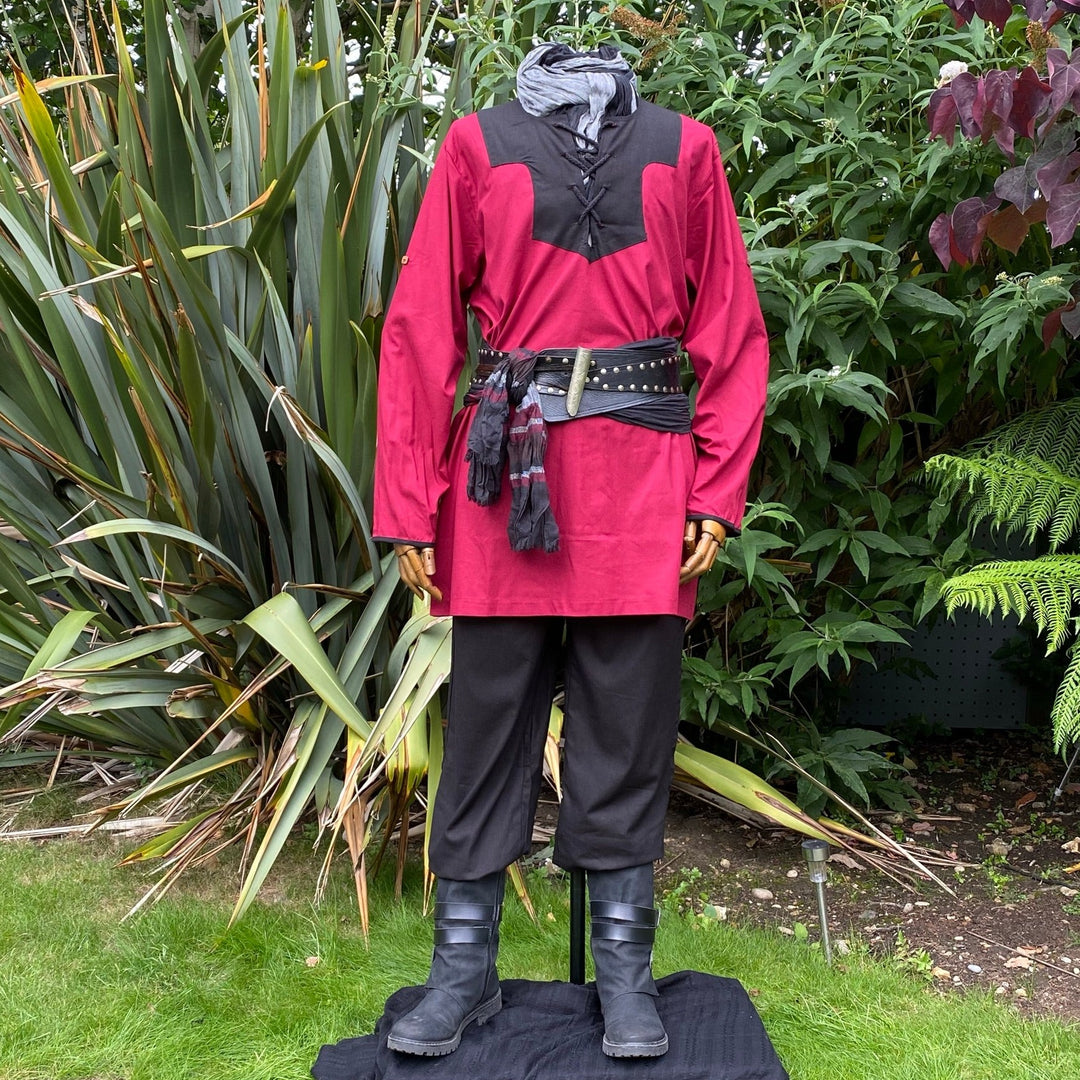 Medieval LARP costume on mannequin in garden, showing red tunic and belt close-up.