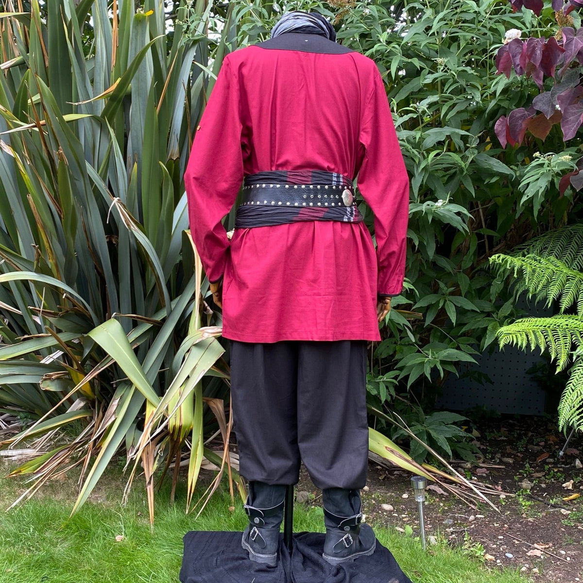 Back view of red shirt with black belt in a medieval LARP.