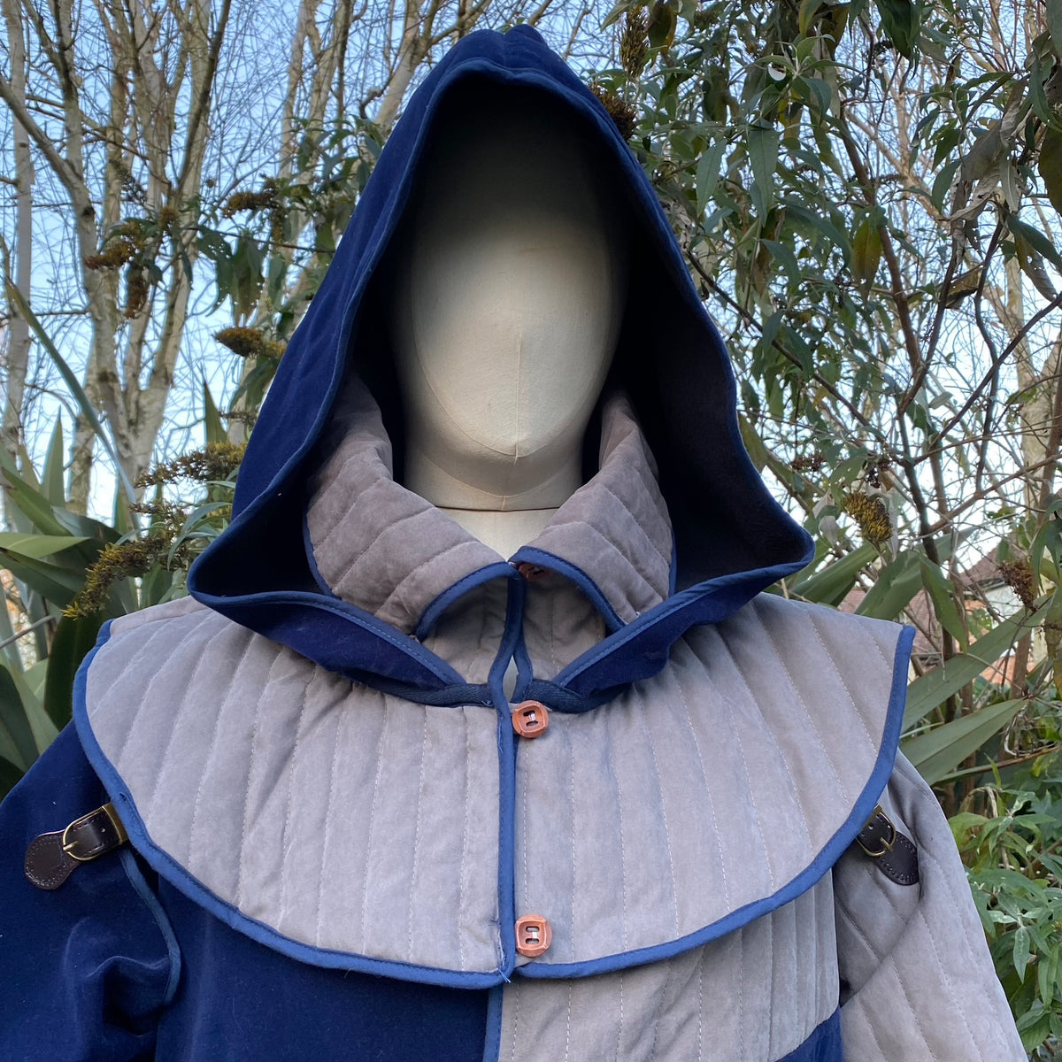 Azure and grey LARP medieval hooded jacket, front view, quilted fabric.