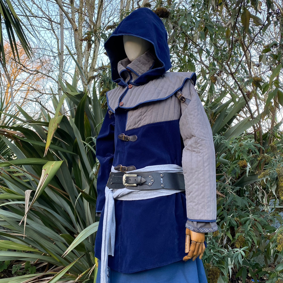Azure LARP warrior set with blue hooded jacket, grey sleeves, belt, and sash.