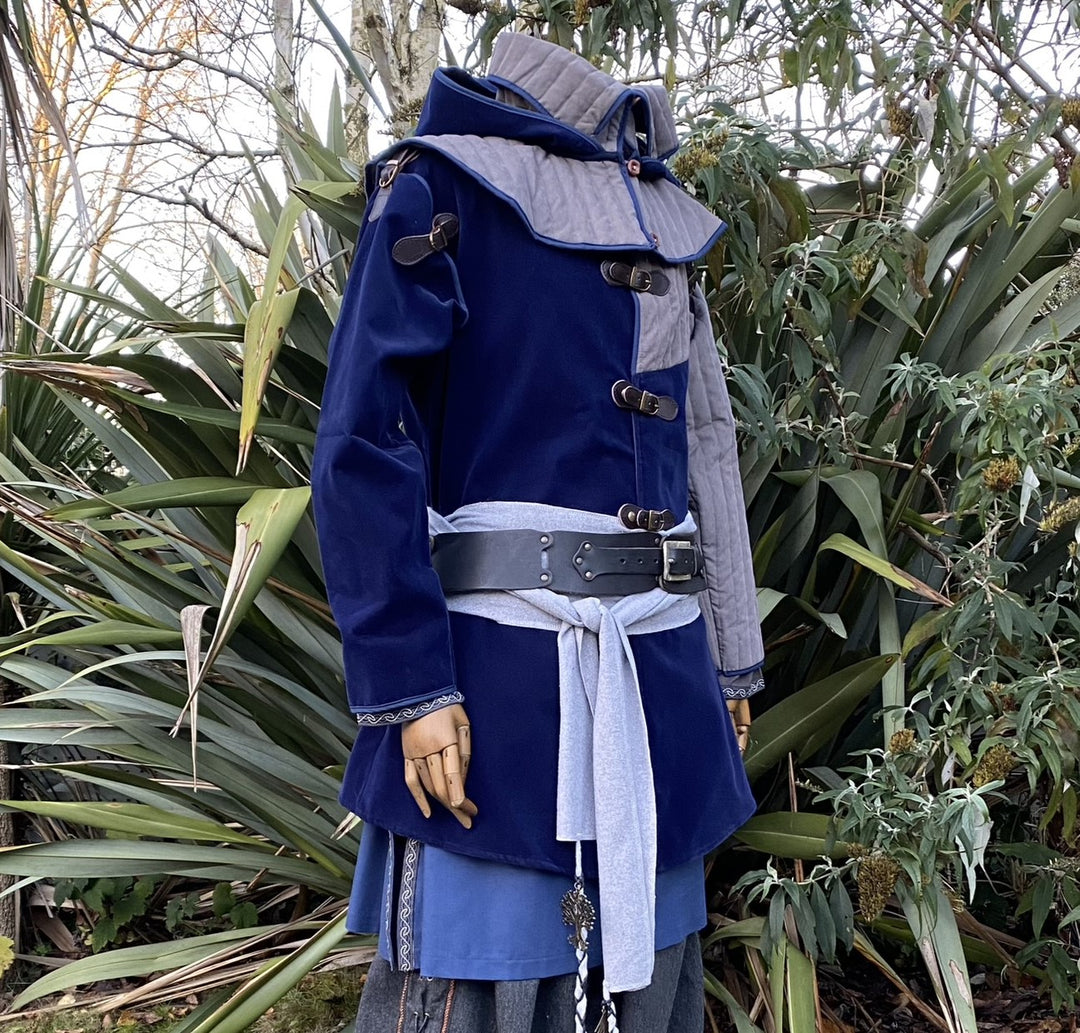 Azure medieval LARP set detail showing leather buckles and quilted shoulder.