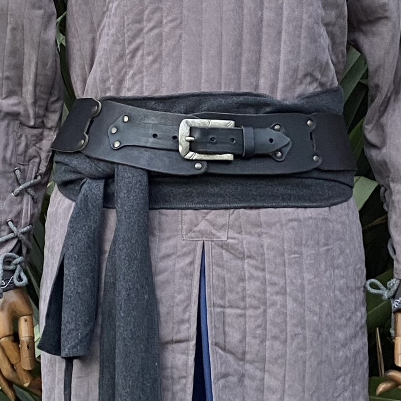 Grey gambeson close-up with black belt and sash for LARP costume detail.