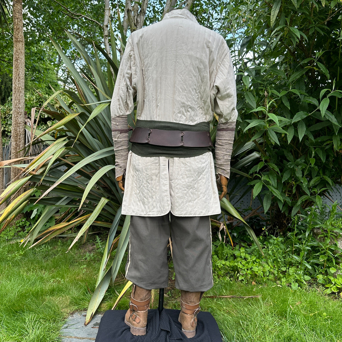 White cotton gambeson from the back, ideal for medieval LARP events.