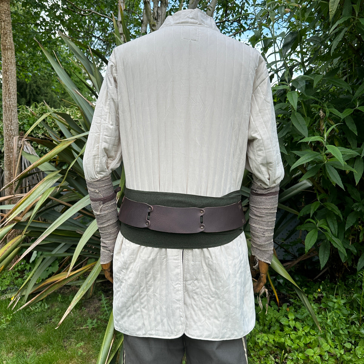 White cotton medieval gambeson from back, quilted fabric, LARP suitable.