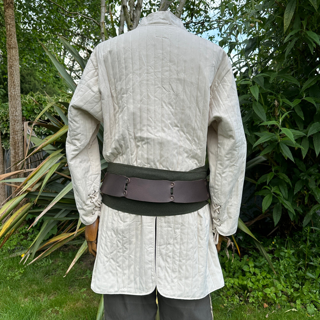 White medieval gambeson with pants and sash, rear view.