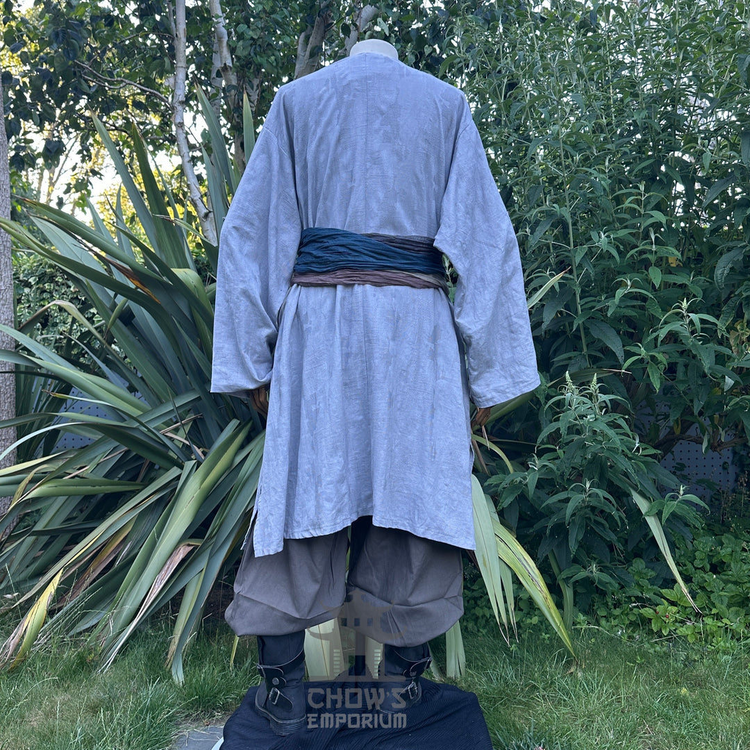 LARP costume set with grey robe, trousers, blue sash, back view.