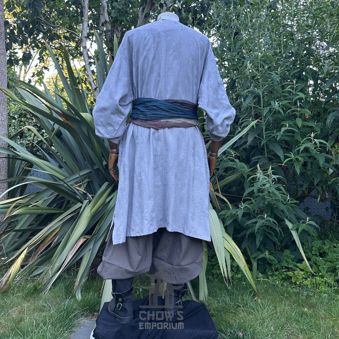 Grey LARP outfit with tunic, trousers, and sash, back view.