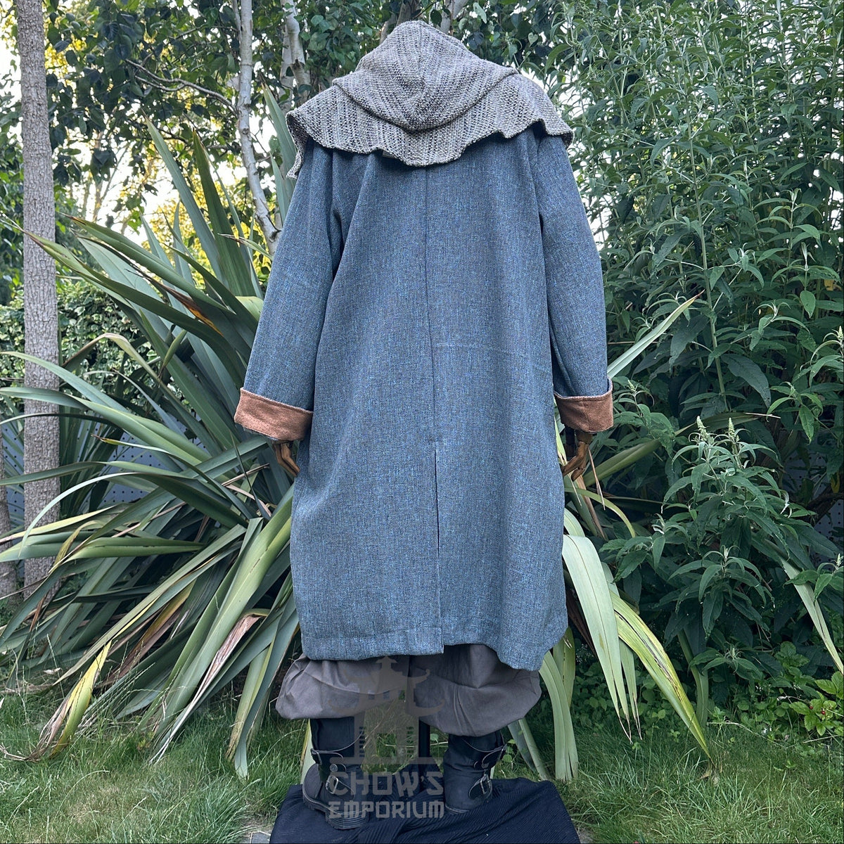Back view of medieval LARP robe with hood, teal and brown tones.