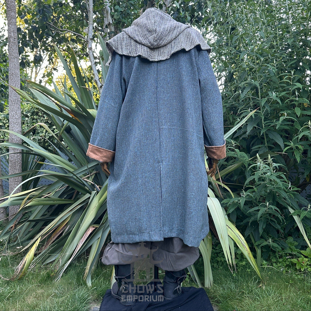 Back view of medieval LARP robe with hood, teal and brown tones.