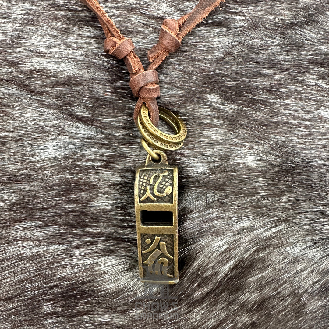 Bronze whistle necklace with engraved designs on leather cord, LARP style.