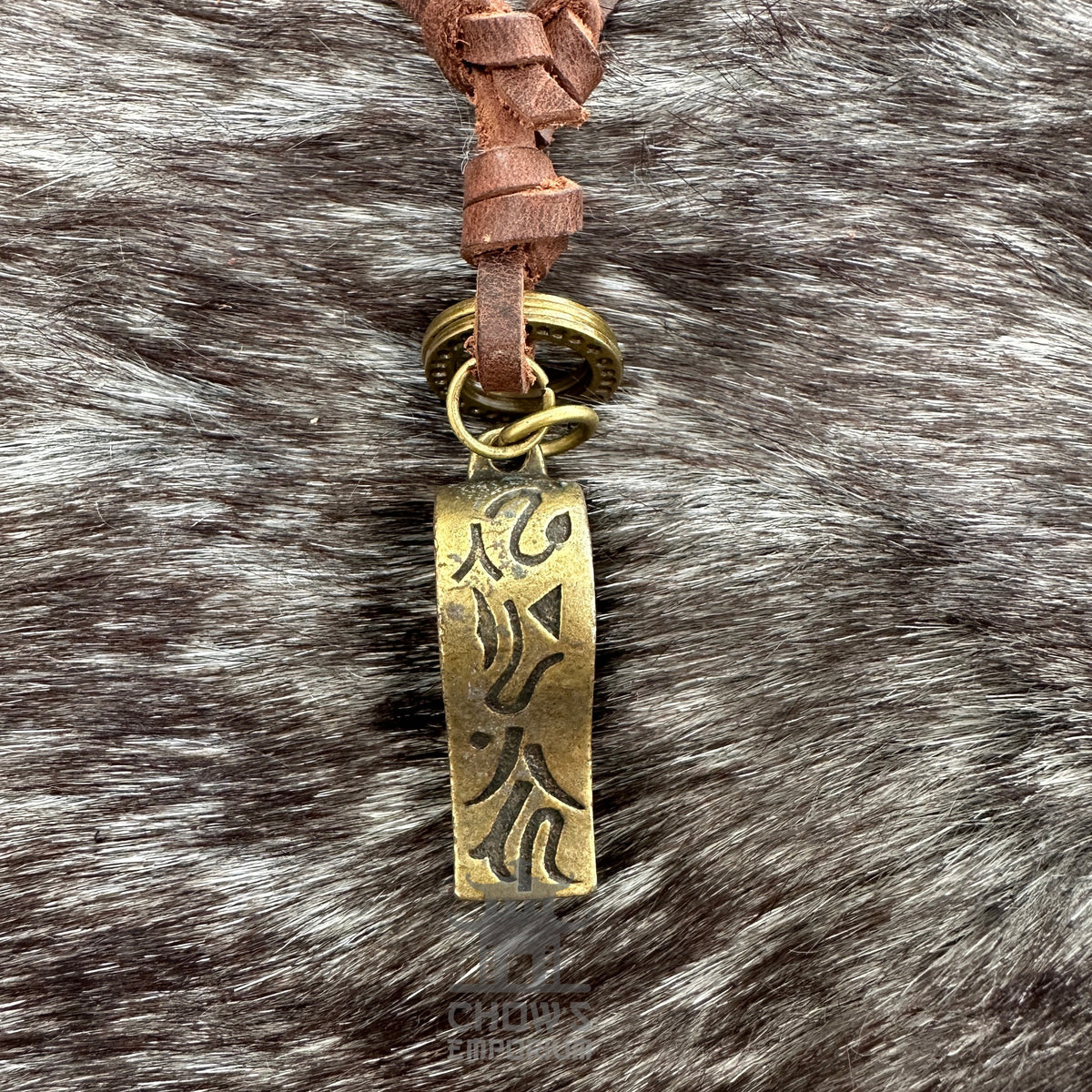 Brass whistle necklace with leather cord, ideal for medieval LARP events.