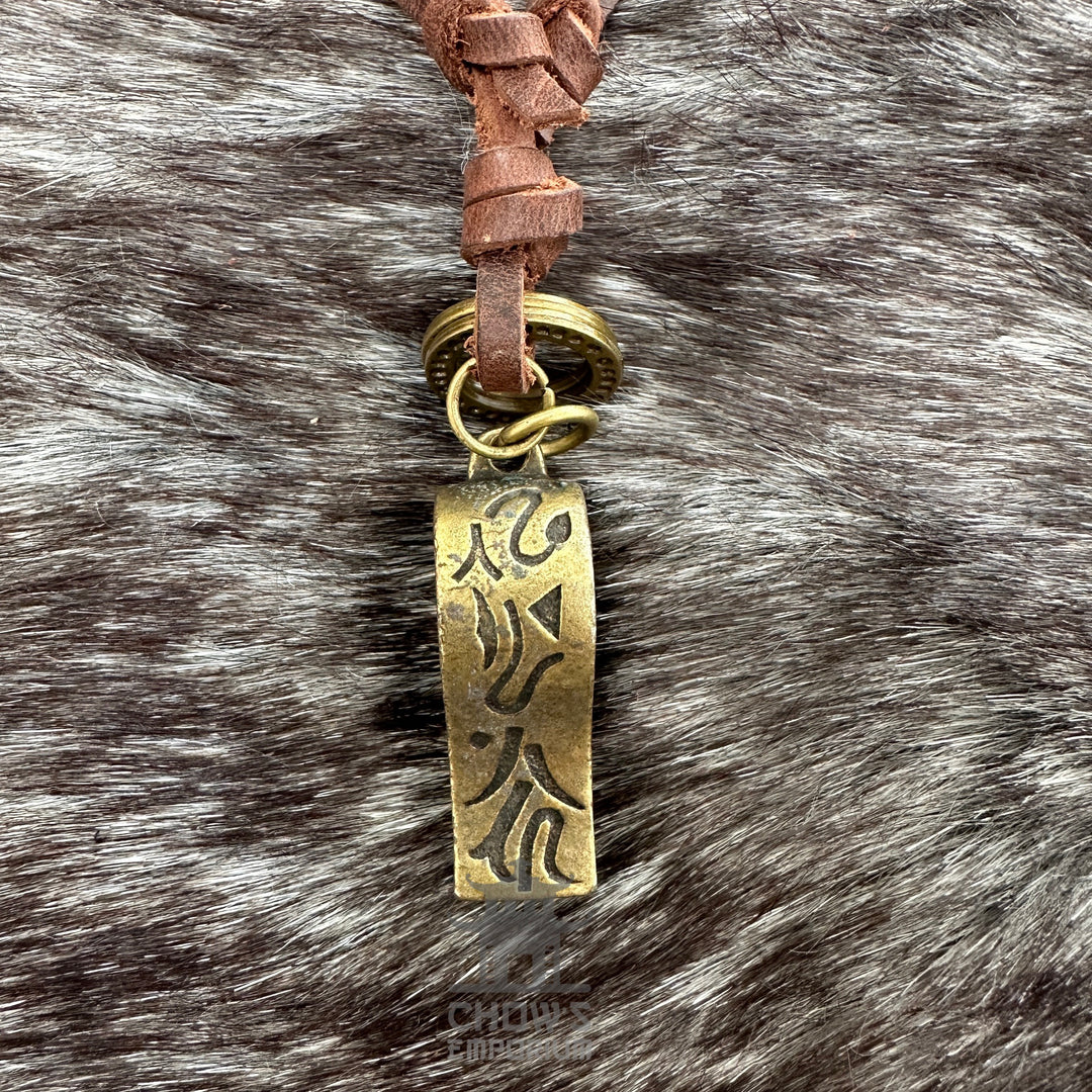 Brass whistle necklace with leather cord, ideal for medieval LARP events.