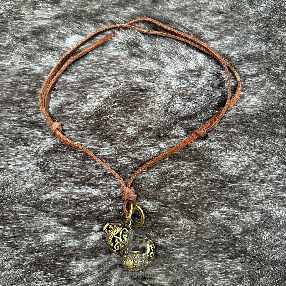 Bronze fish orb necklace on brown leather cord for LARP or medieval attire.