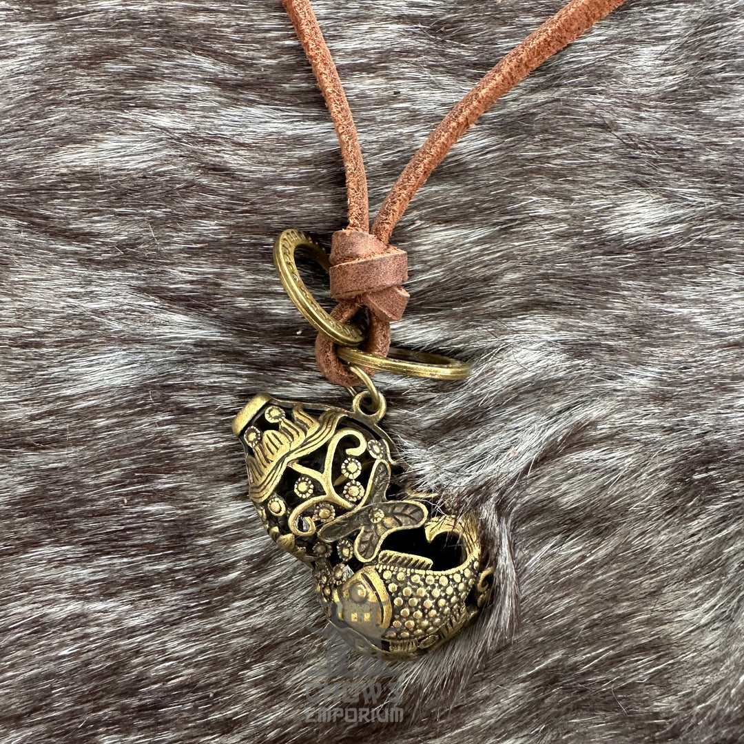Bronze fish-shaped orb necklace on brown leather cord.