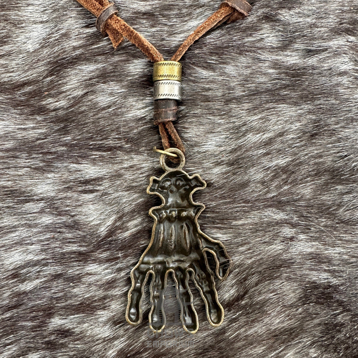 Pirate claw necklace with rustic bronze pendant on brown leather cord, LARP accessory.