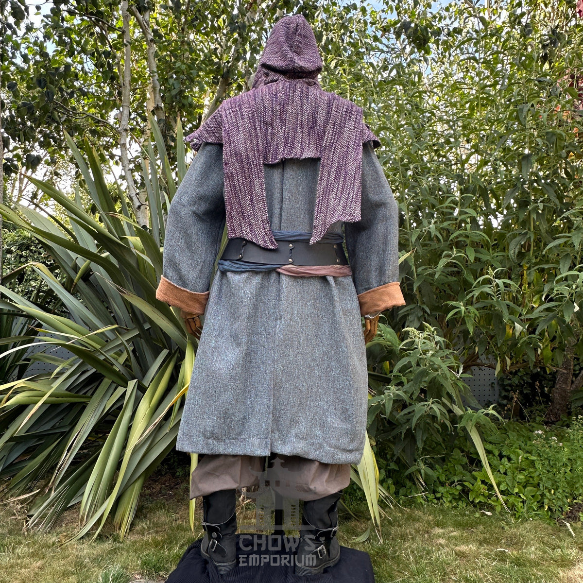 Rear view of medieval LARP outfit, grey robe, brown cuffs, purple hood detail.