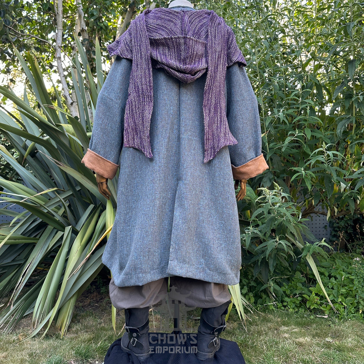 Rear view of blue LARP robe with brown cuffs, purple hood.