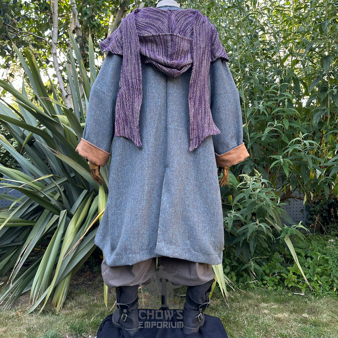 Rear view of blue LARP robe with brown cuffs, purple hood.
