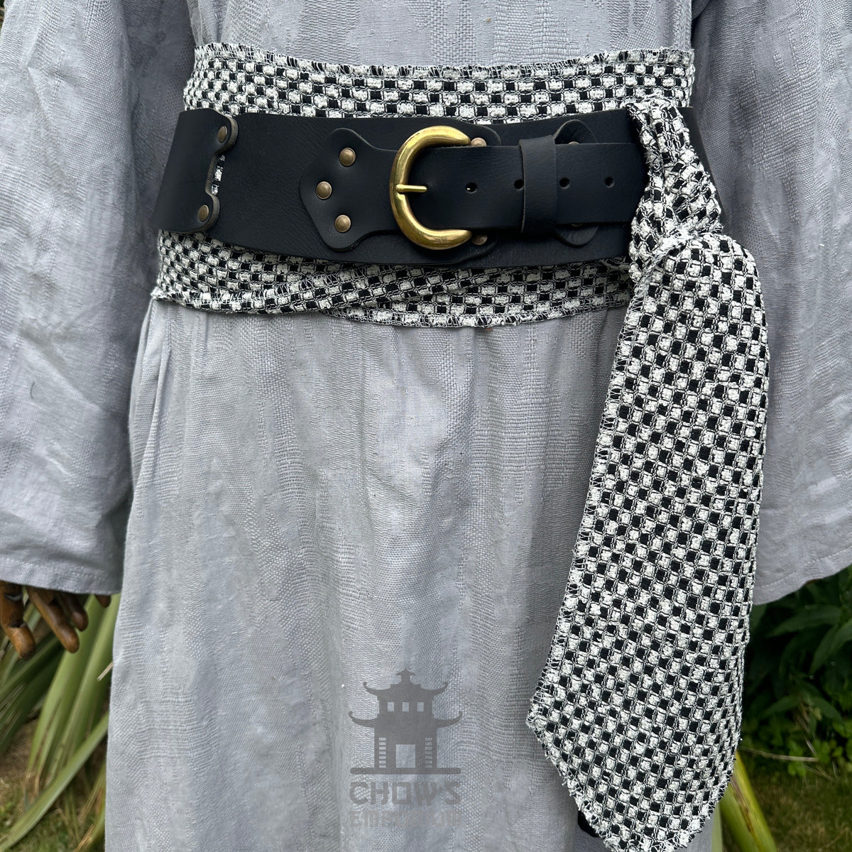 Black and white check LARP belt with buffalo leather and brass buckle.