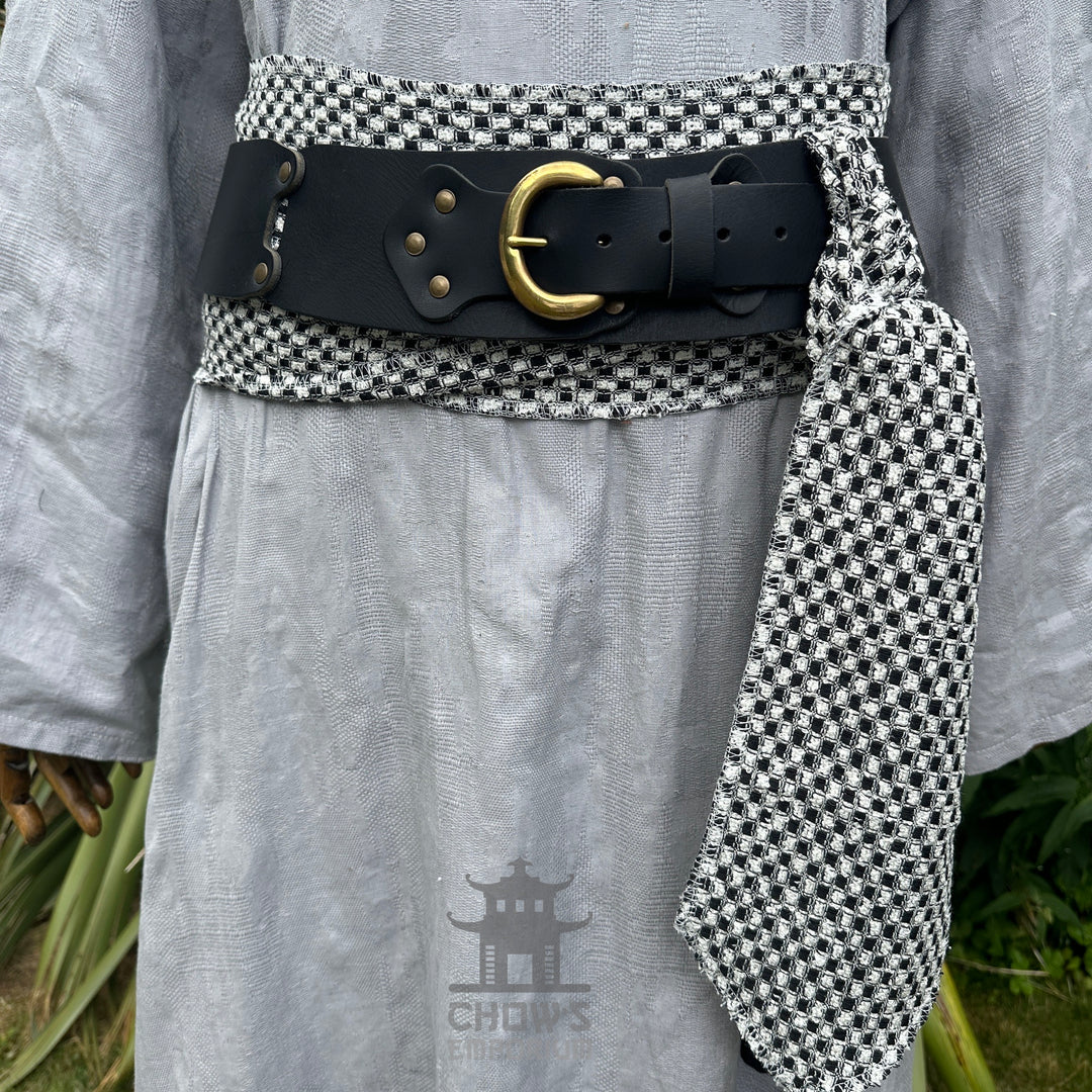 Black and white check LARP belt with buffalo leather and brass buckle.